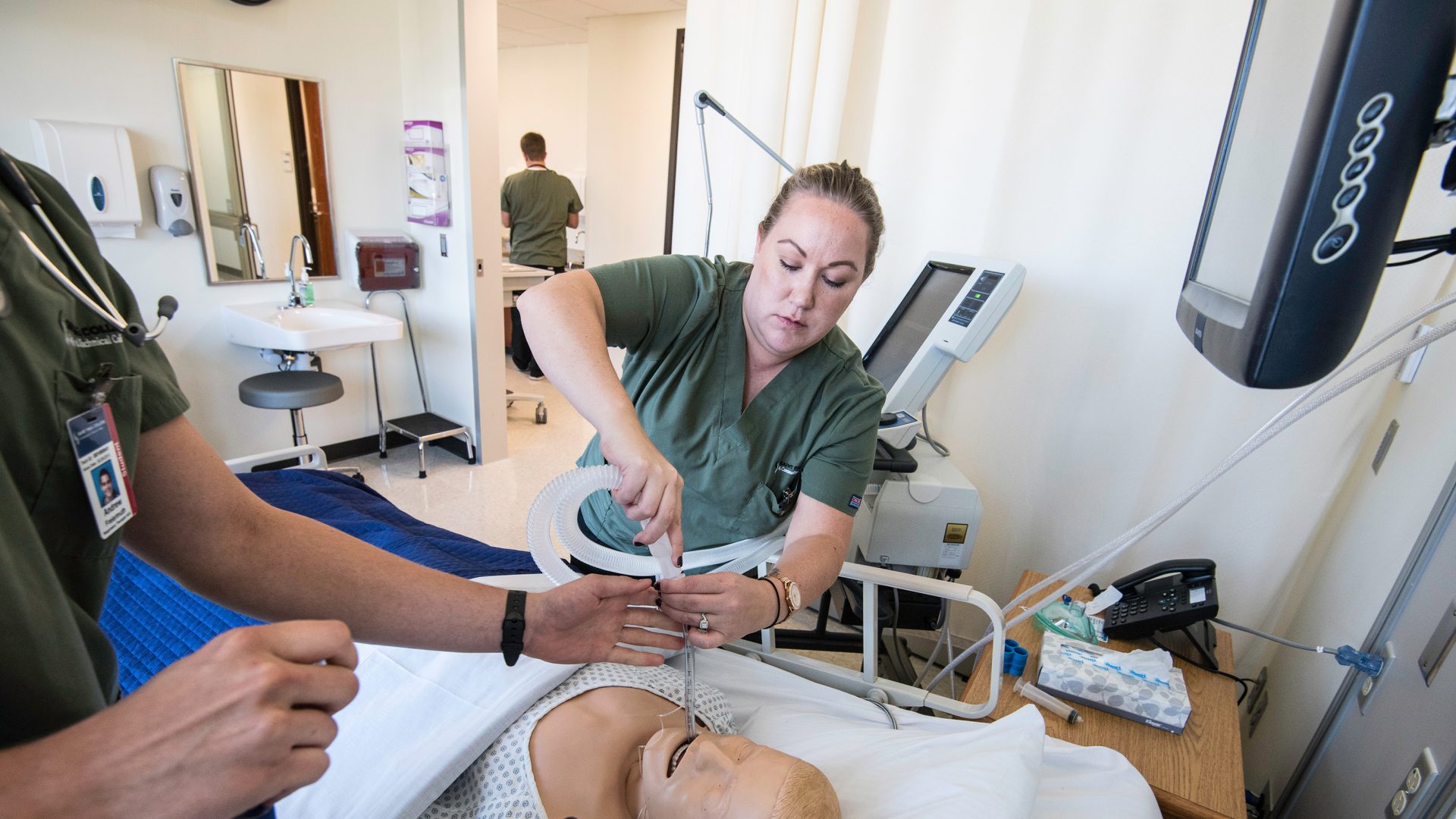 Photo of students in the SIM center.
