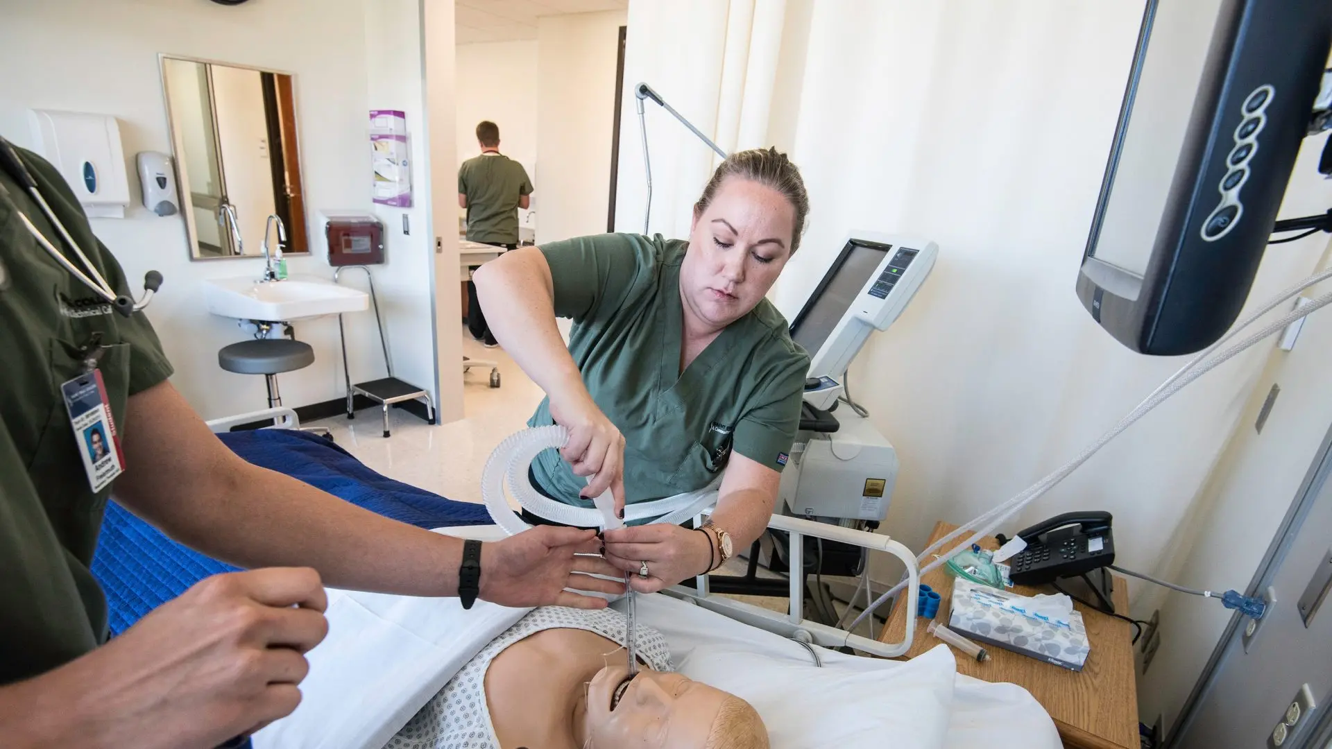 Photo of students in the SIM center.