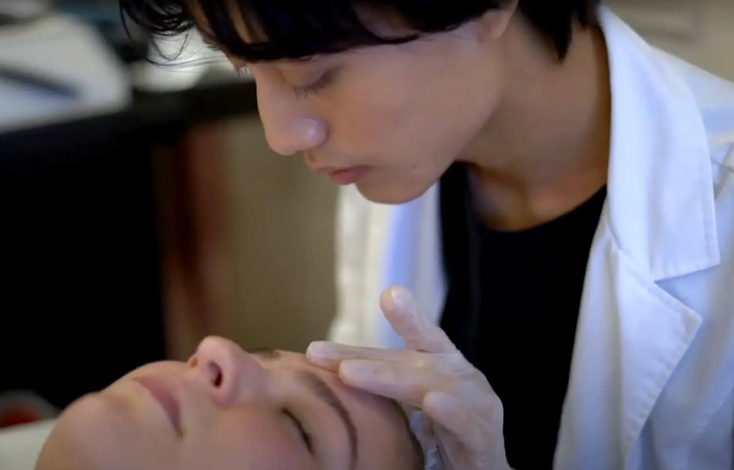 Photo of student learning to be an esthetician.