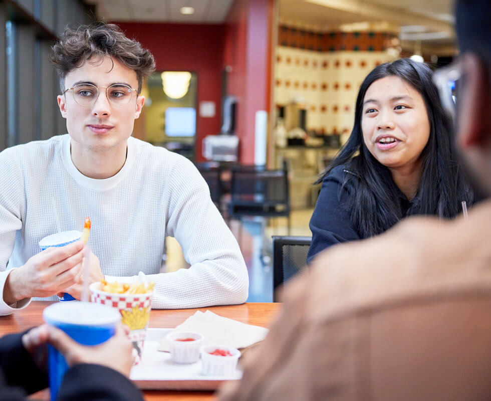 Students having lunch in the cafeteria.