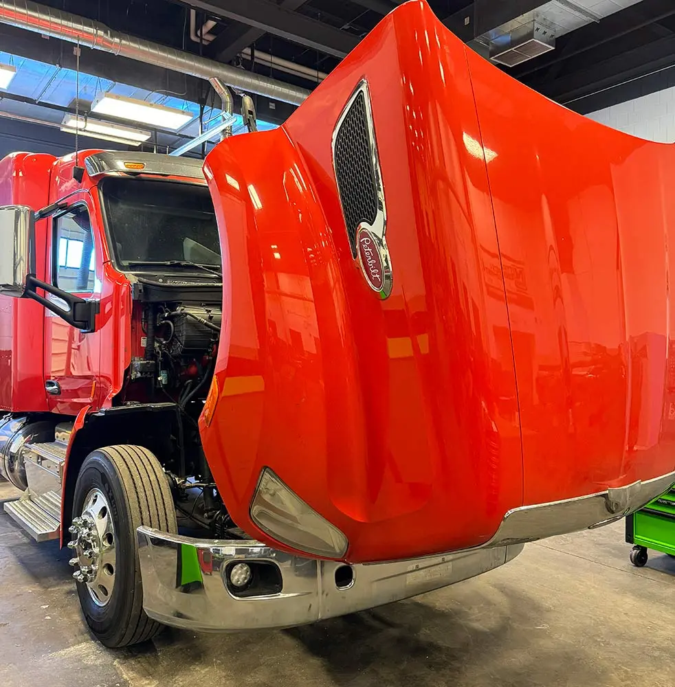 photo of a truck with hood lifted