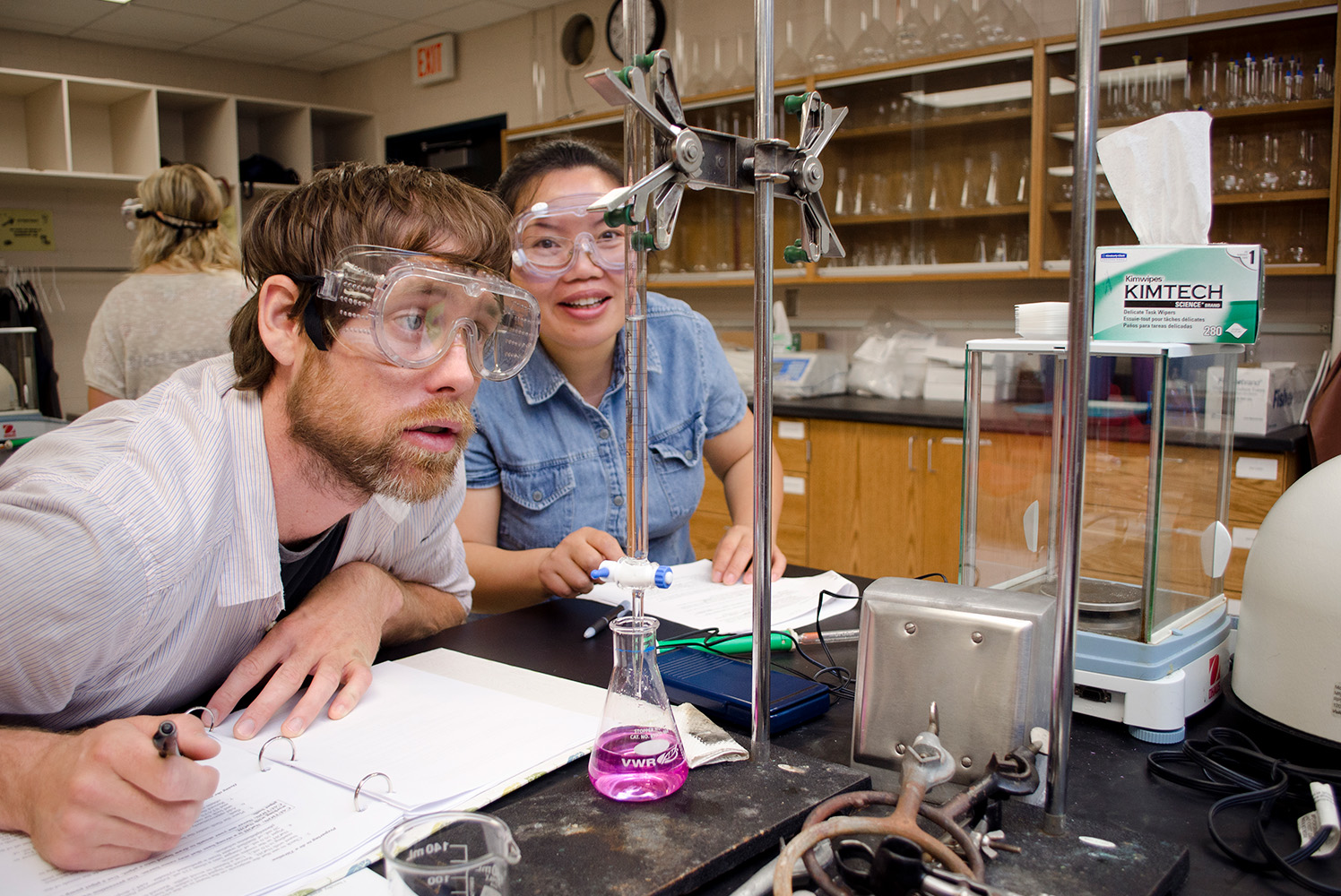 Photo of students learning in the chemistry lab.