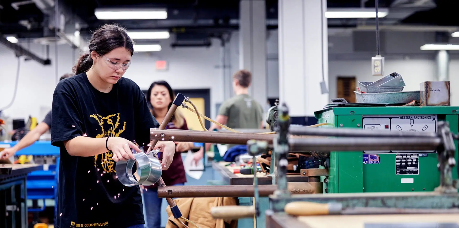 Photograph of a student in Sheet Metal class.
