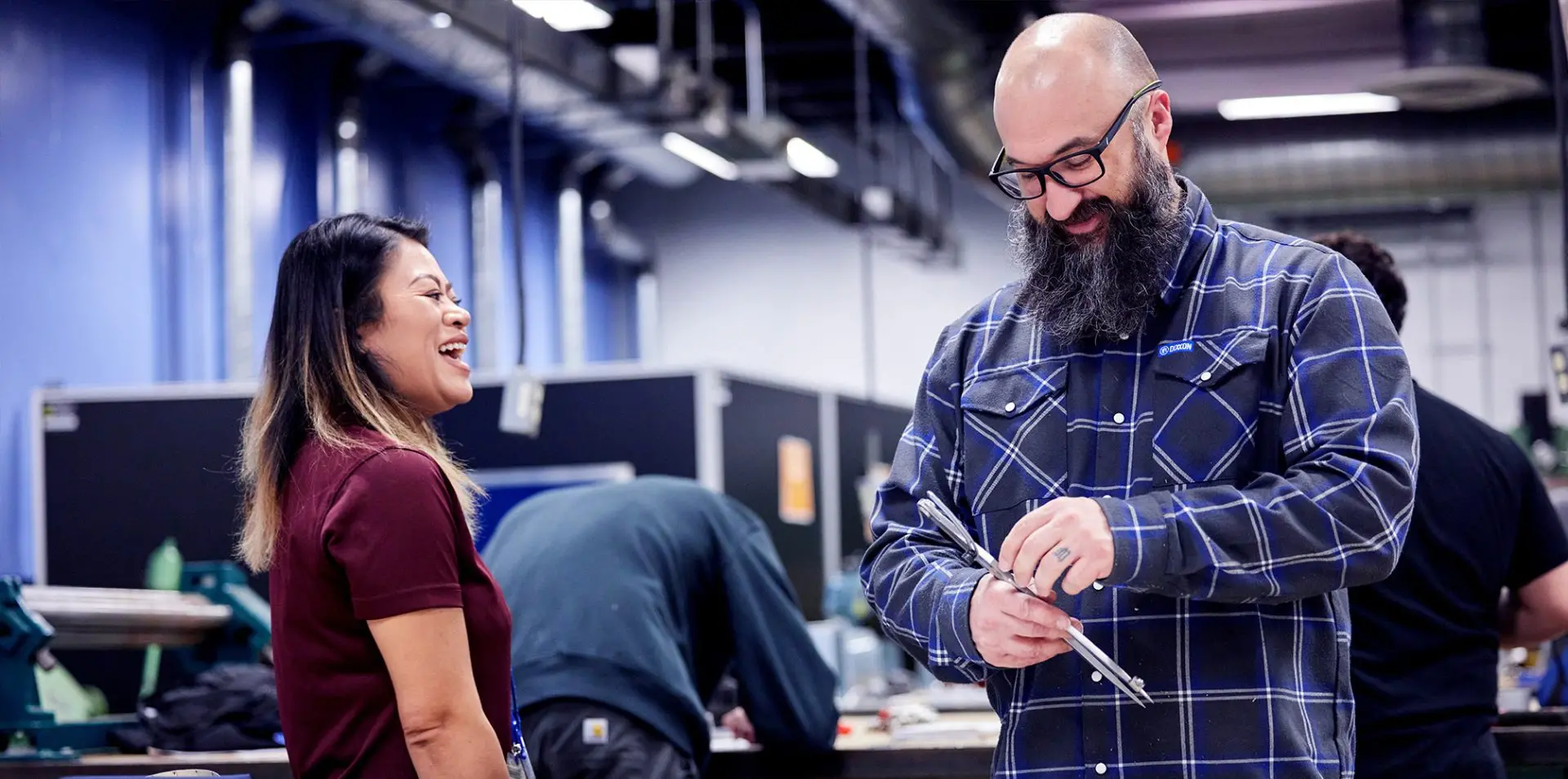 Photograph of an instructor and student in Sheet Metal class.