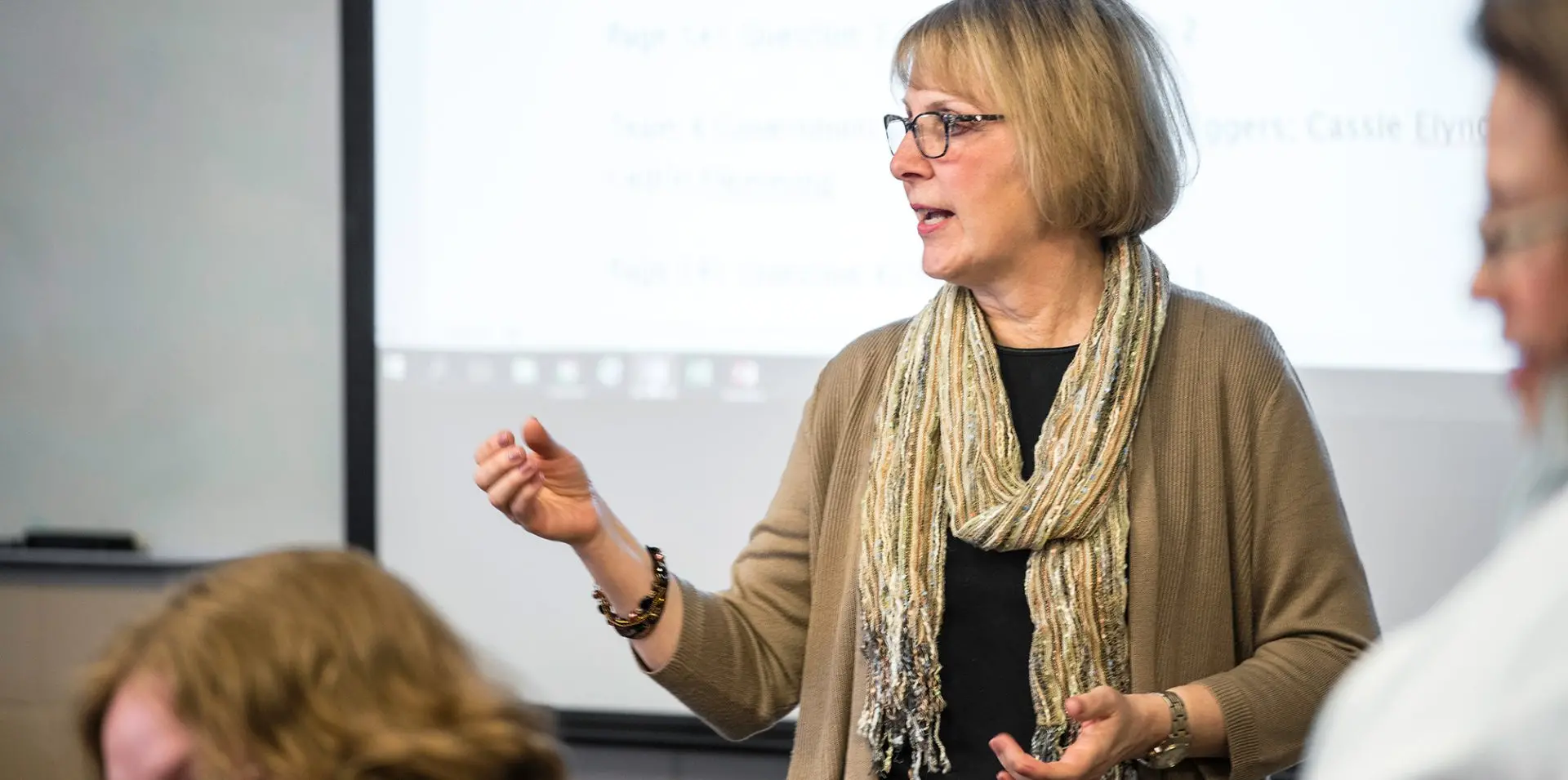 Photo of instructor in class.