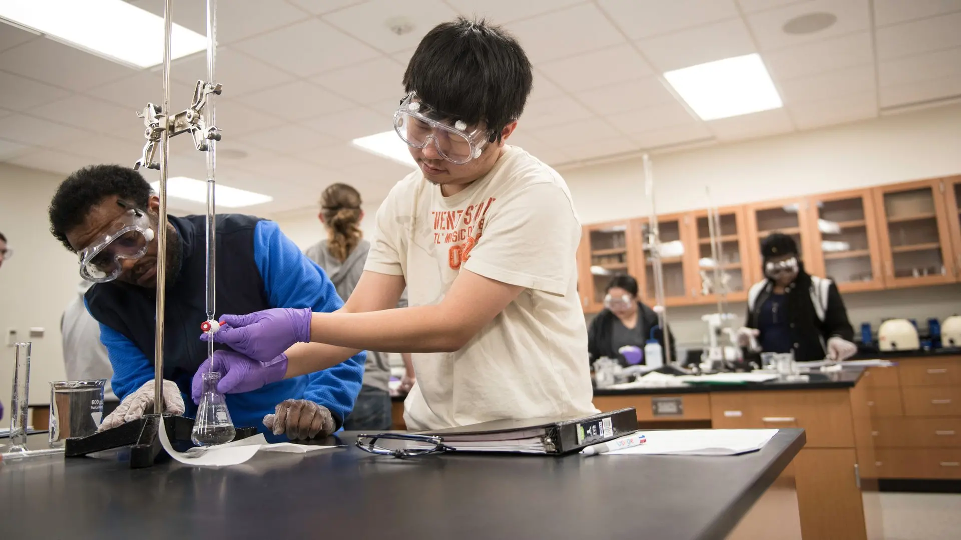 Photo of students learning in the chemistry lab.