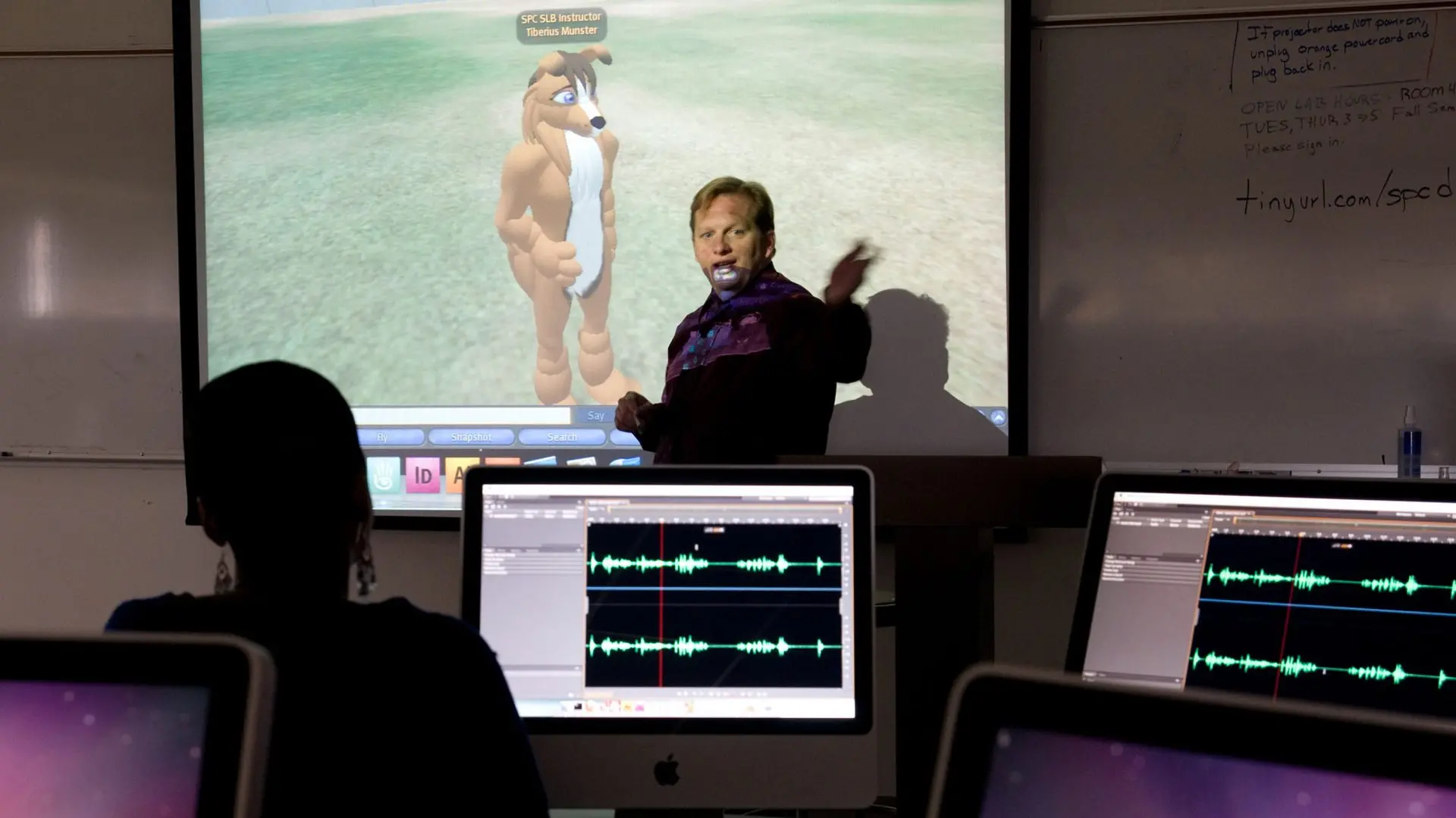 Photo of instructor in class.