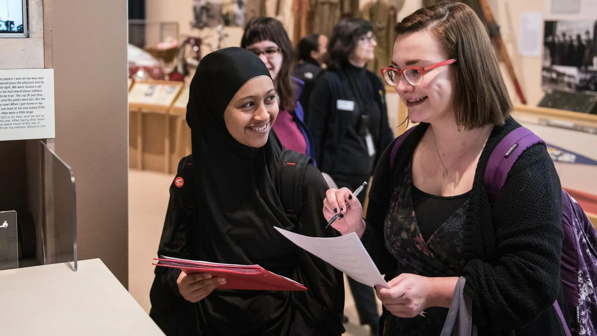 Photo of a group of students talking.