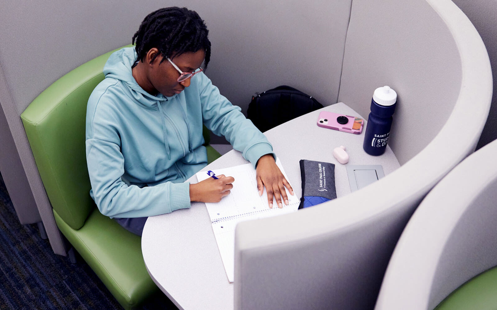 Photo of student in the library work-study.