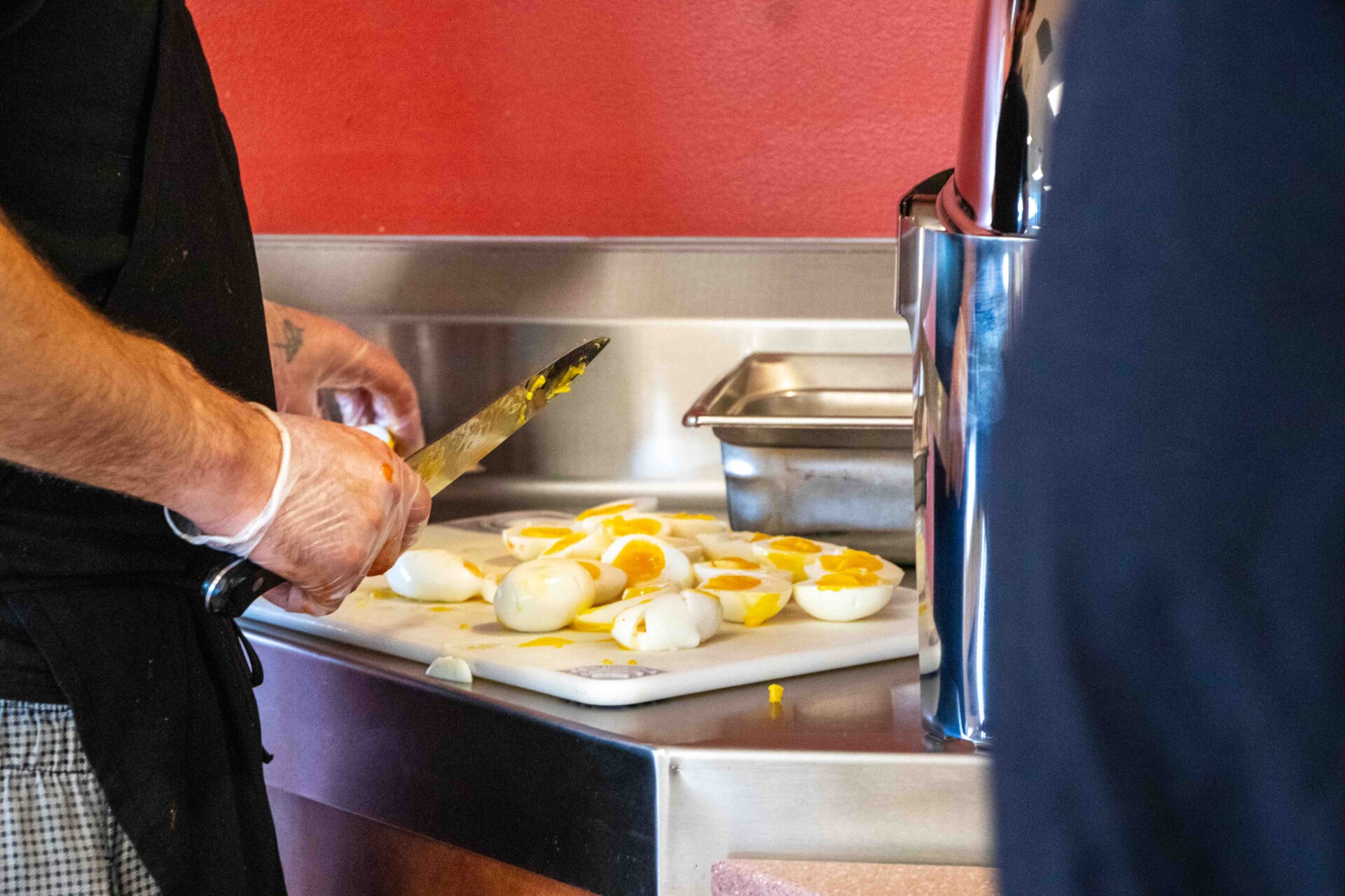 Chefs cut eggs for chili context