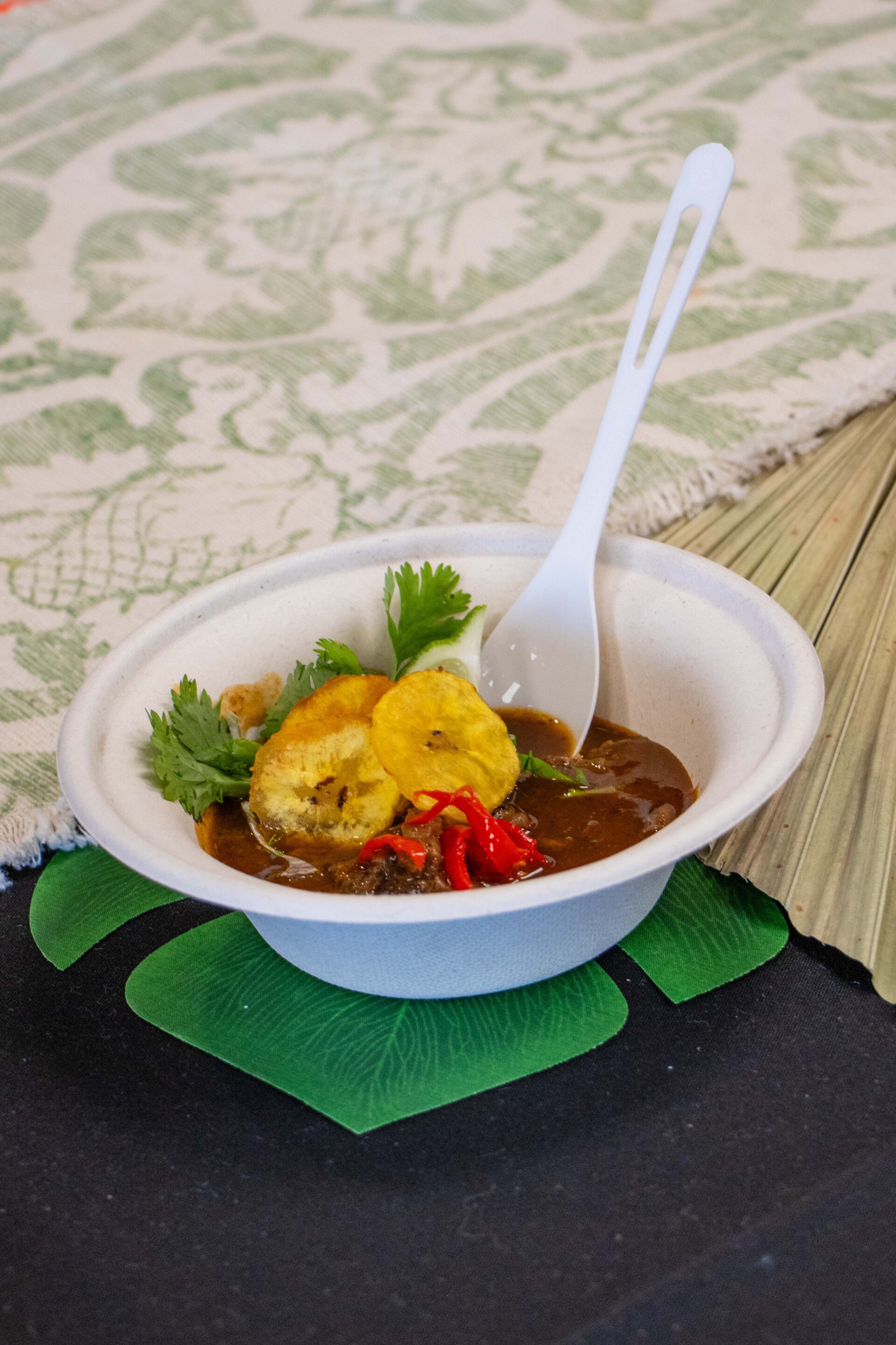 unique chili with white spoon; chili features plantains