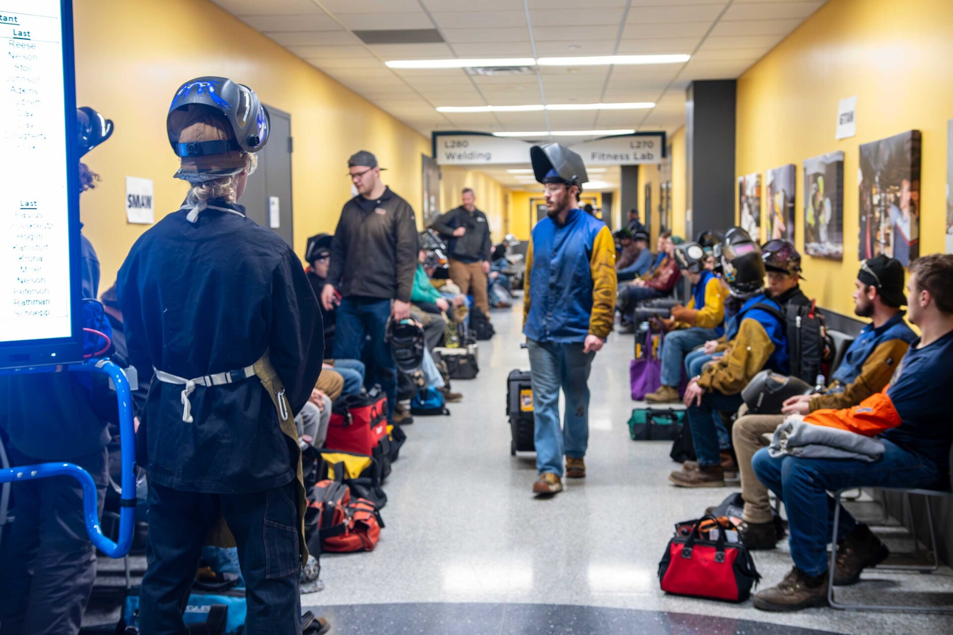 Group shot of welders waiting to compete