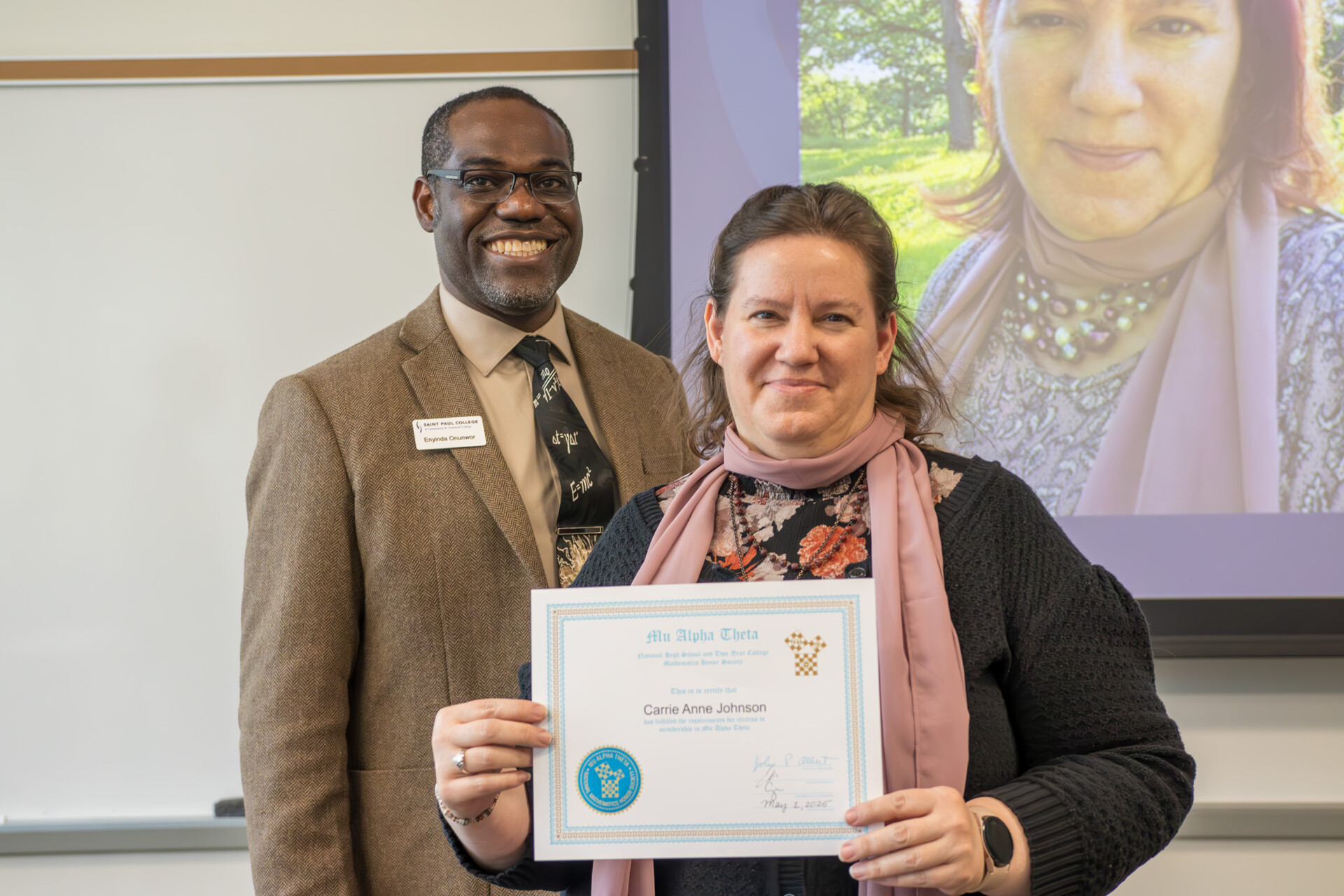Dean Onunwar and student with certificate