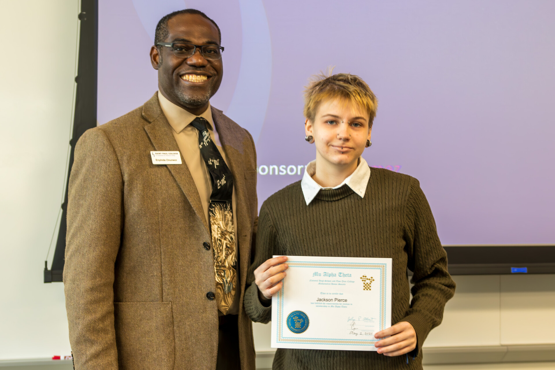 Dean Onunwar and student with certificate