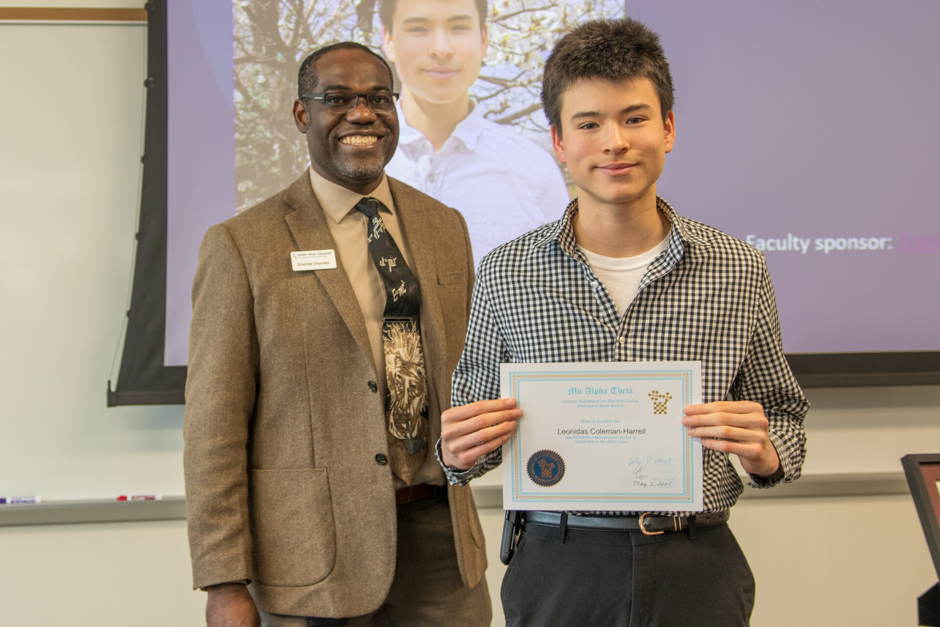 Dean Onunwar and student with certificate