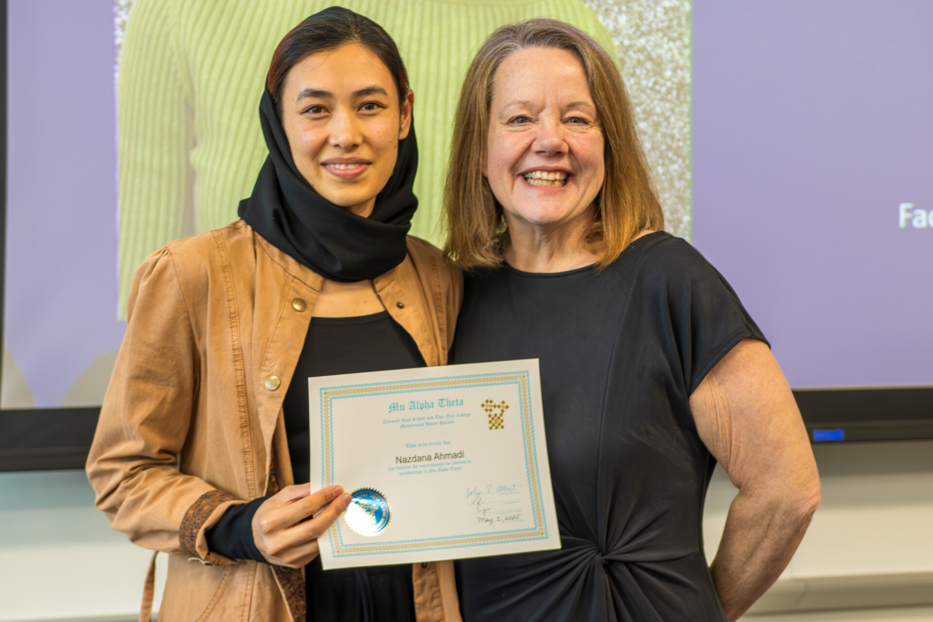 Instructor Pam Shumacher and student holding certificate
