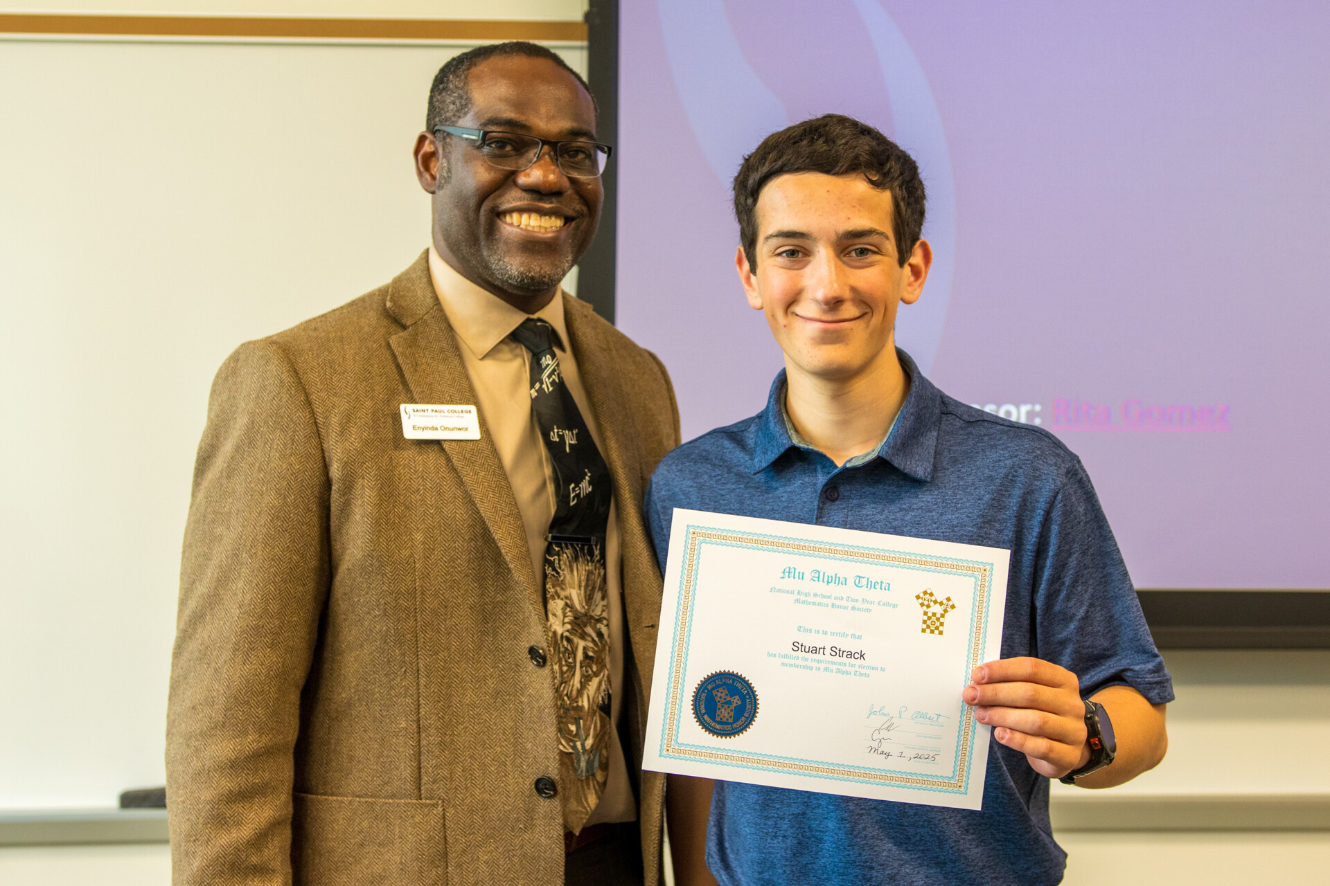 Dean Onunwar and student with certificate