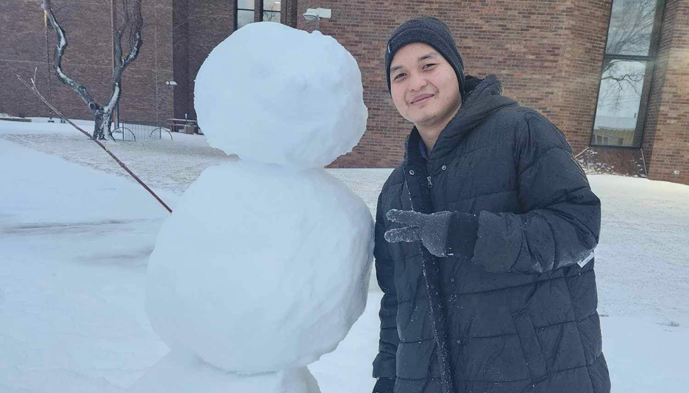 Pattarapol (Pat) Muepae with a snowman