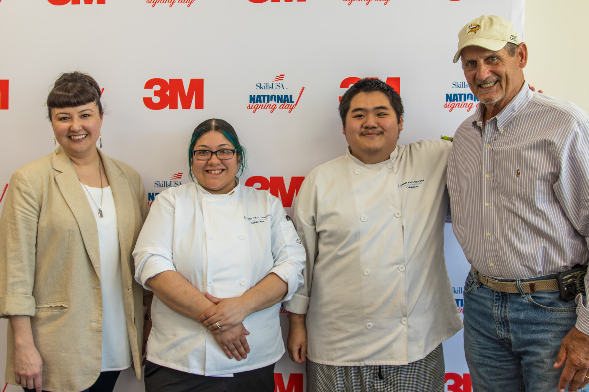 Group photo of Sara Johannes, two culinary students and Scott Studwell 
