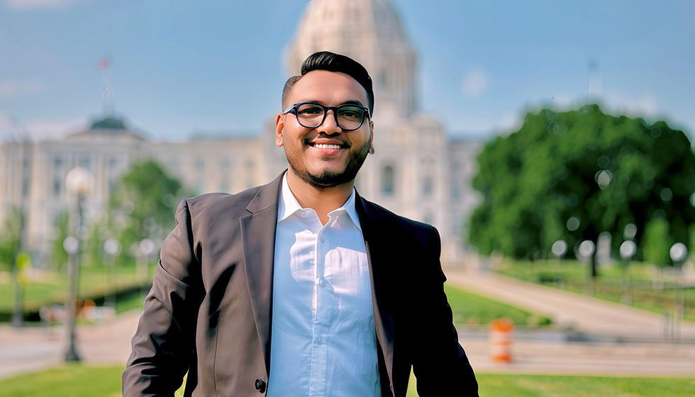 Syed Joy in front of capitol building
