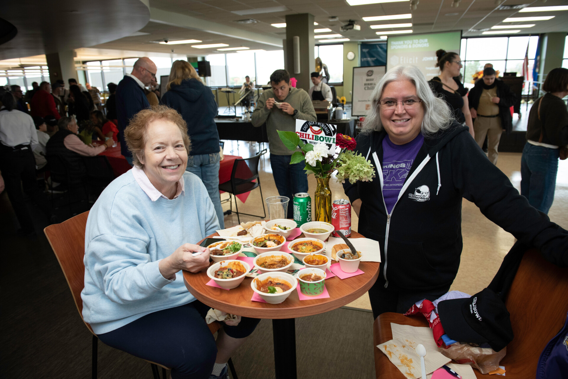 happy attendees eating chili