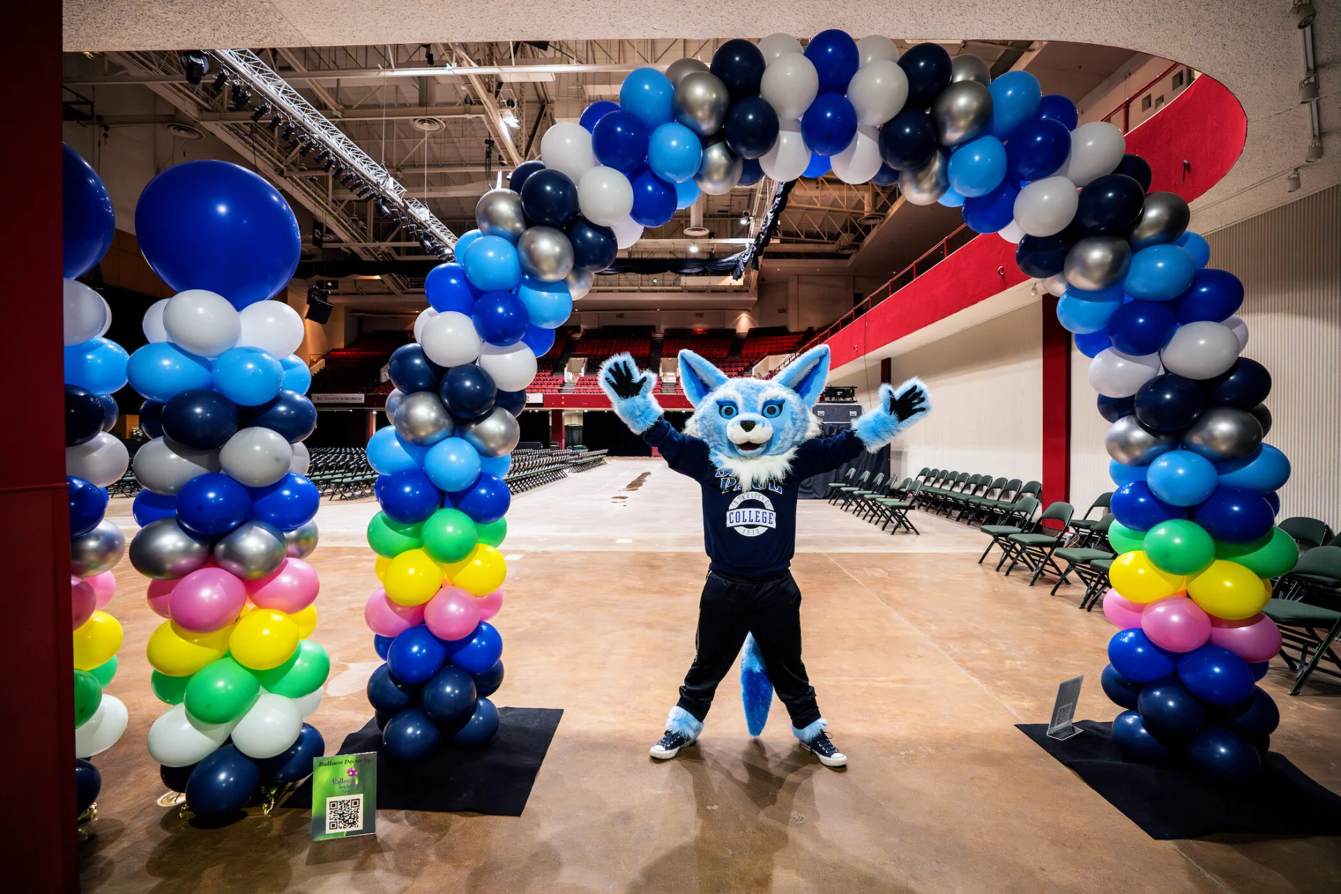 Sky Blue Fox Mascot Poses at Graduation