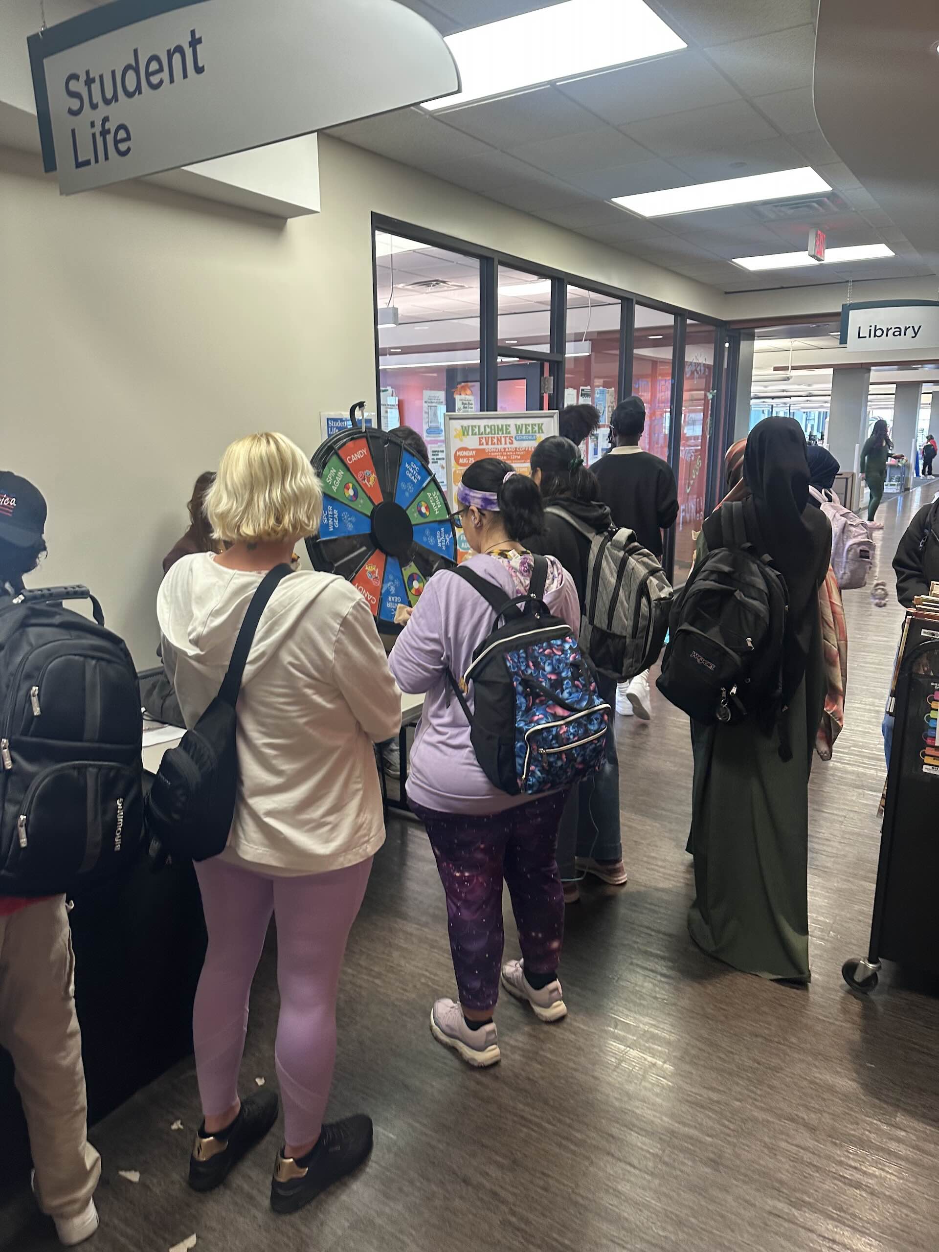 Students line up outside student life during the First Week