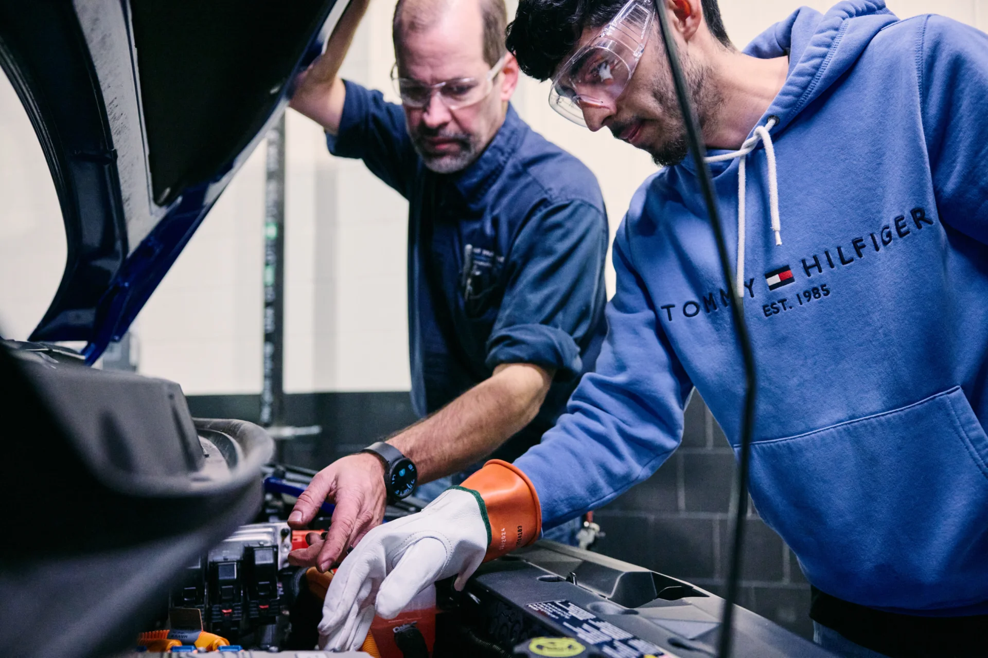 checking under the hood of a vehicle