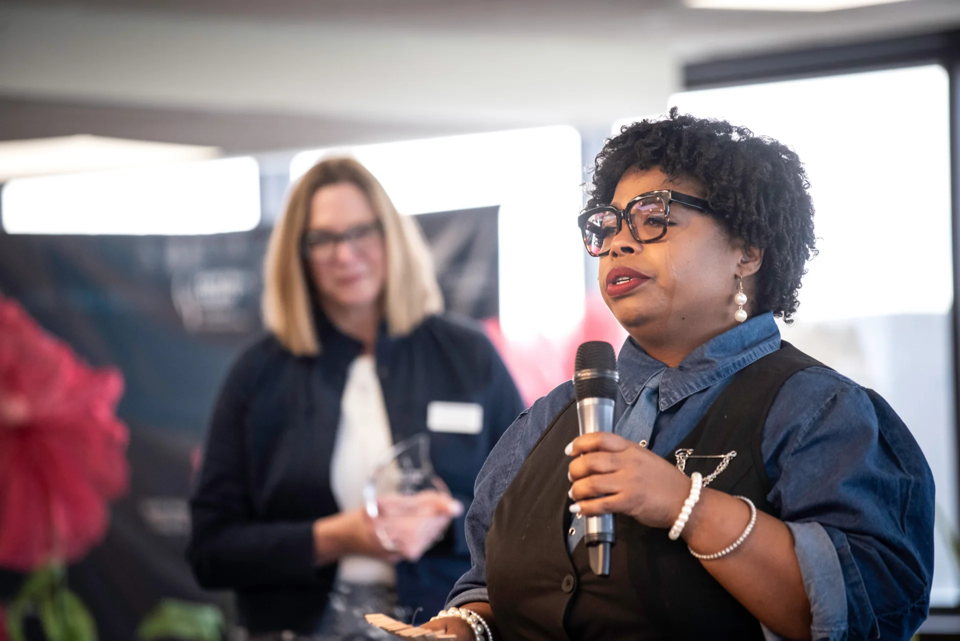Tameka Jones Speaking at the Friends on the Lawn with President Peaslee in the background