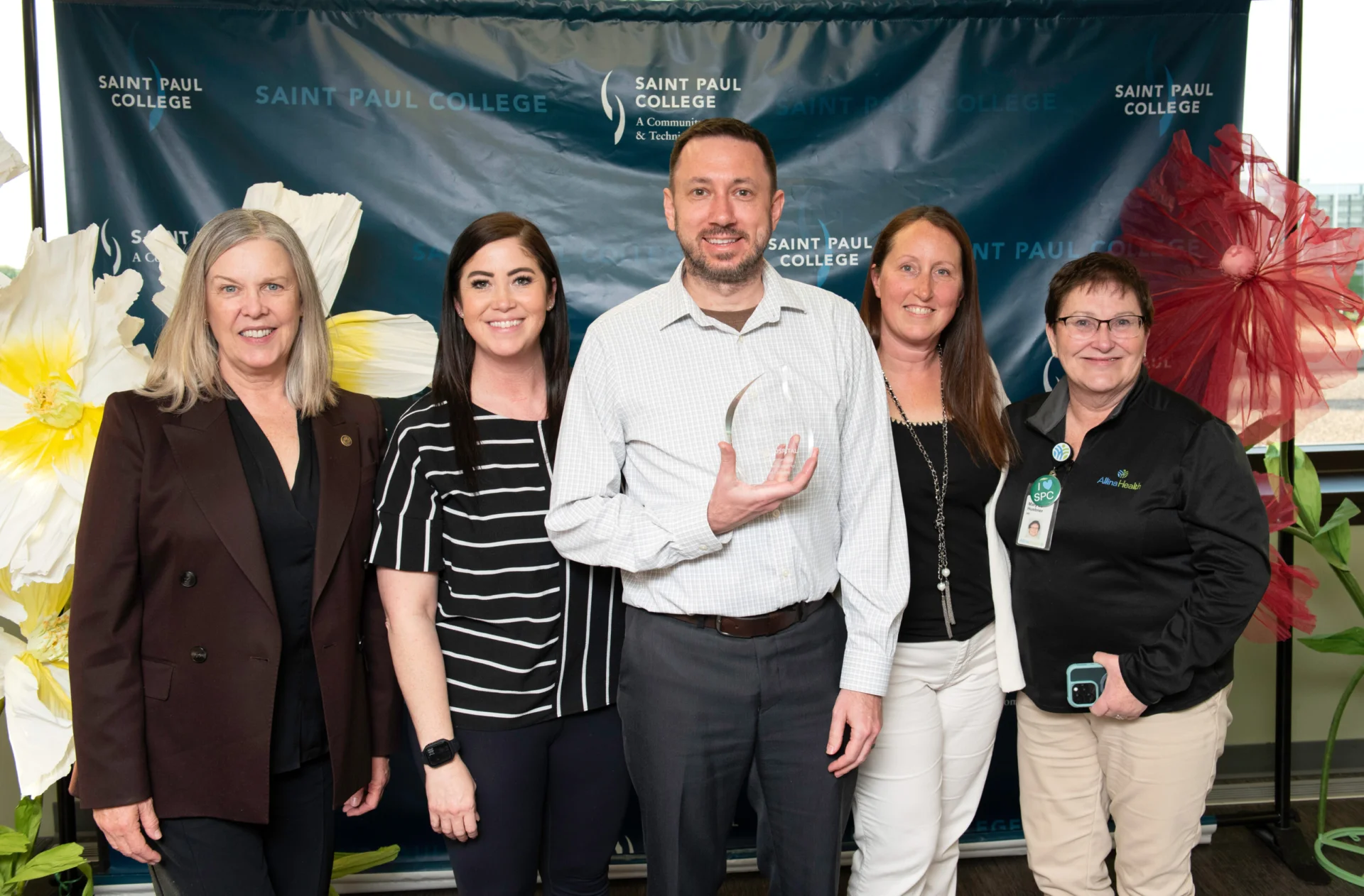 Dan K pictured with a group accepting award for Partner of the Year