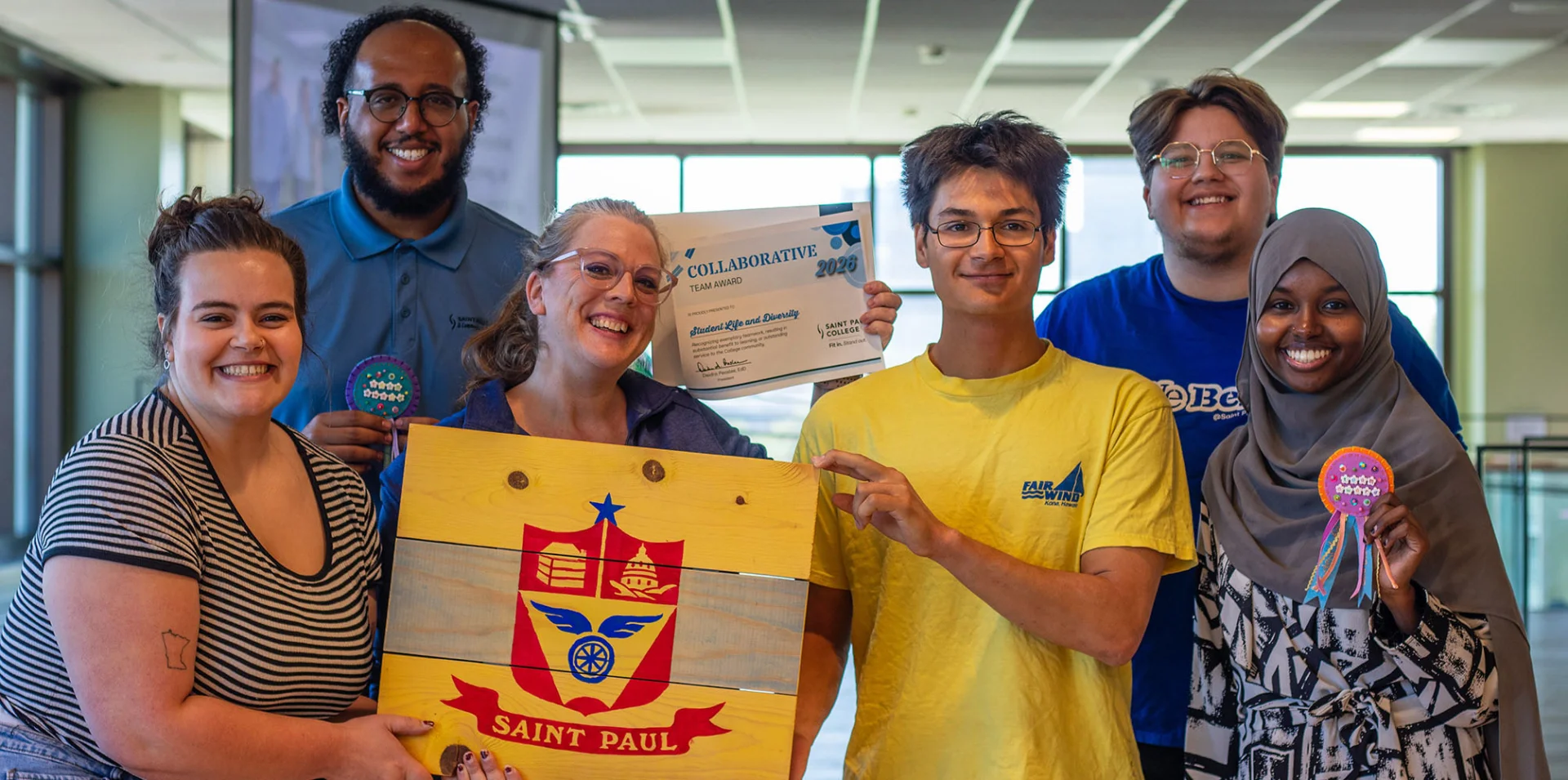 Student Life & Diversity Team members pose with their collaborative award during Saint Paul College’s end-of-year celebration.