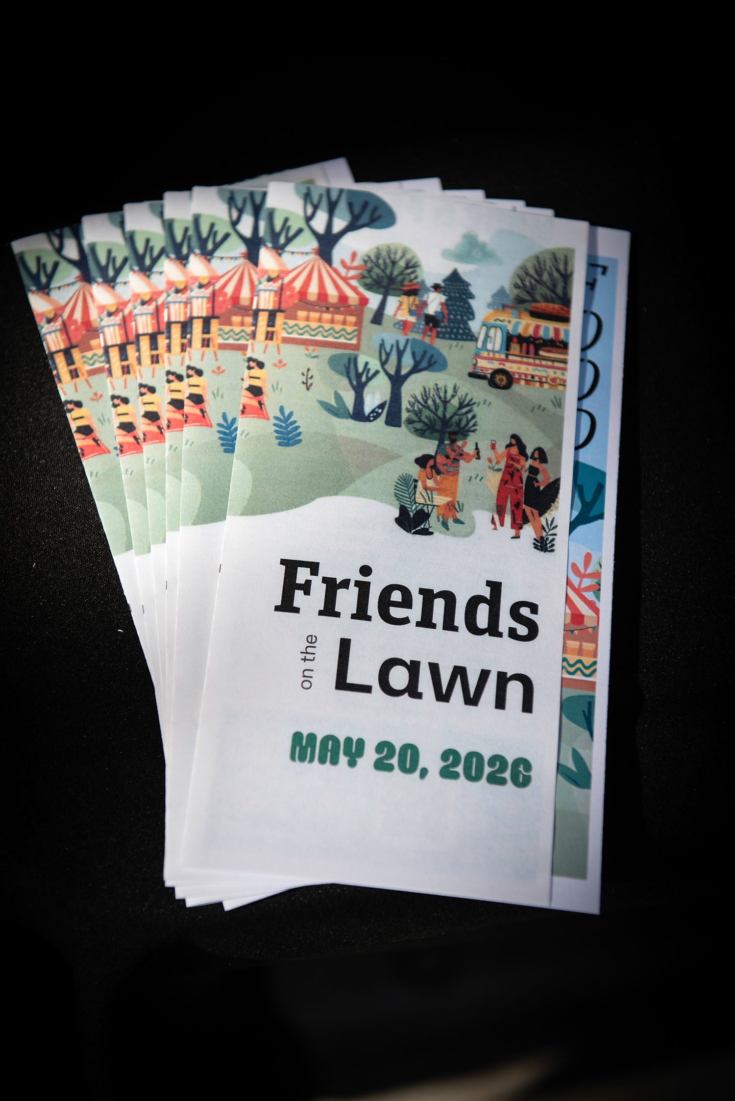 Friends on the Lawn 2026 event programs displayed at Saint Paul College fundraising event