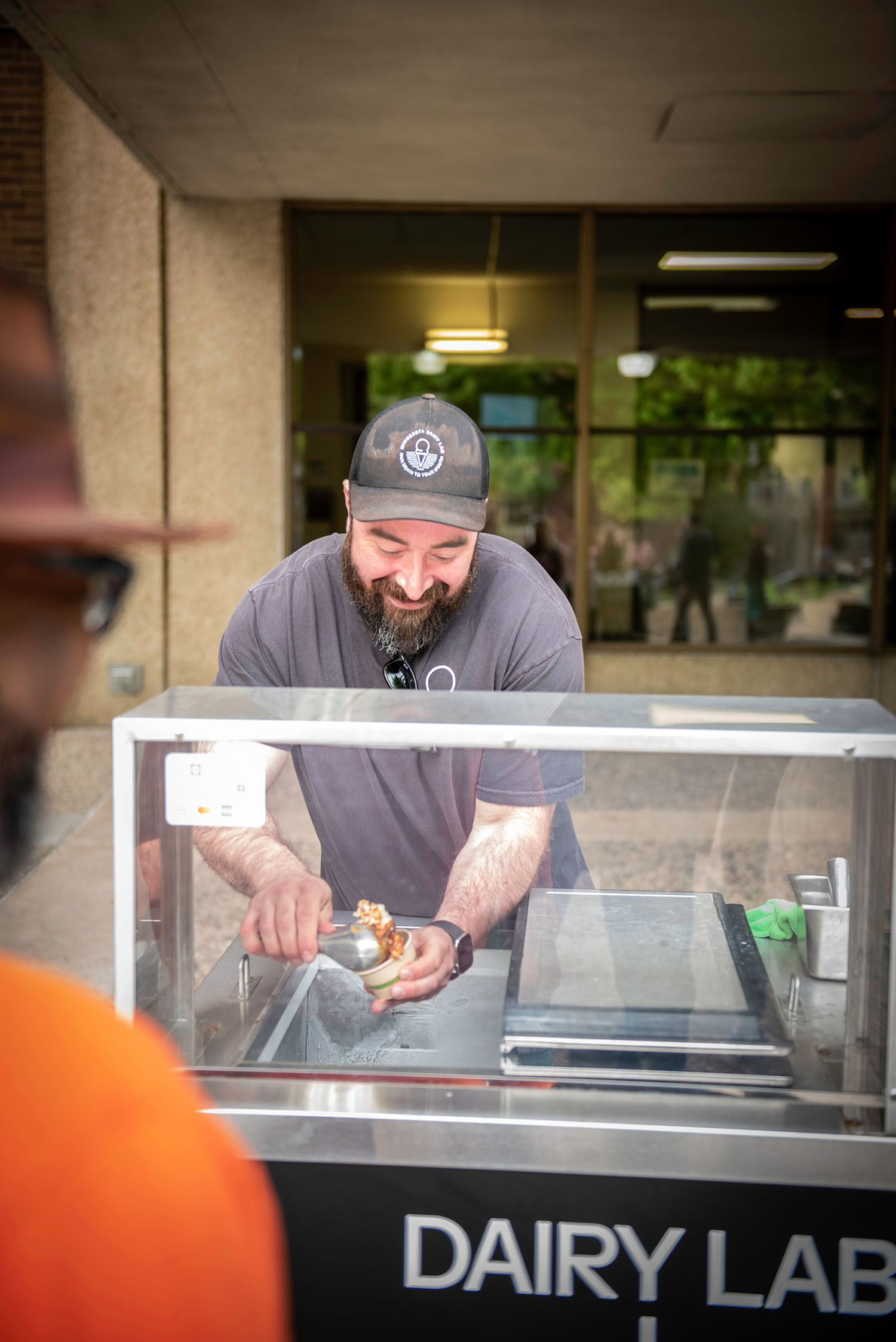 Minnesota Dairy Lab vendor serving dessert at Friends on the Lawn 2026 Saint Paul College fundraiser
