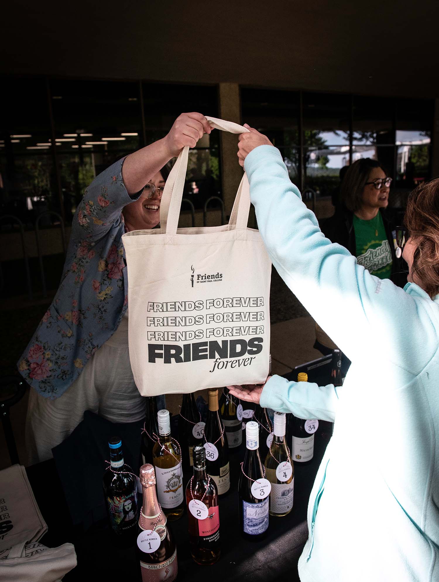 Guests participating in wine pull at Friends on the Lawn 2026 Saint Paul College fundraiser event