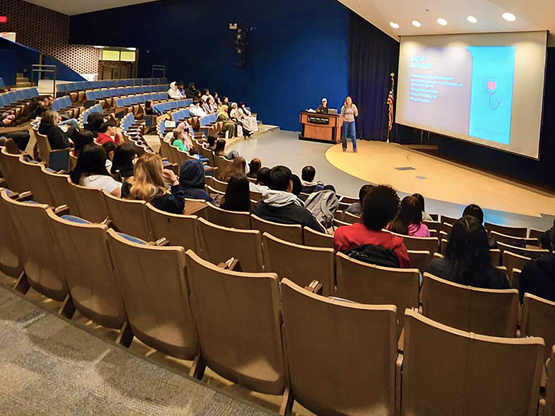 High school students attend a healthcare career presentation in a Saint Paul College auditorium during SPC Career Sampler event