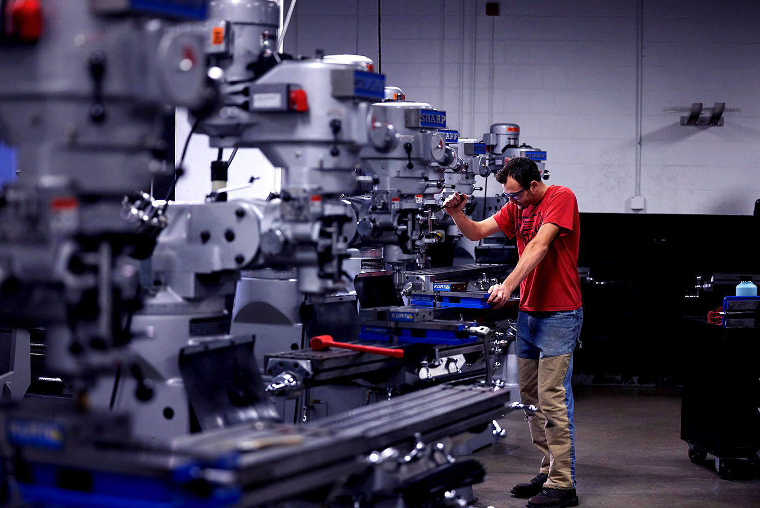 Student drilling on the middle machine to gain practical skills