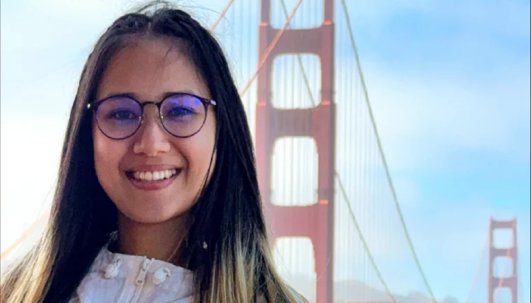 Eaint Phu Myint in a windbreaker and glasses with the Golden Gate Bridge in the background