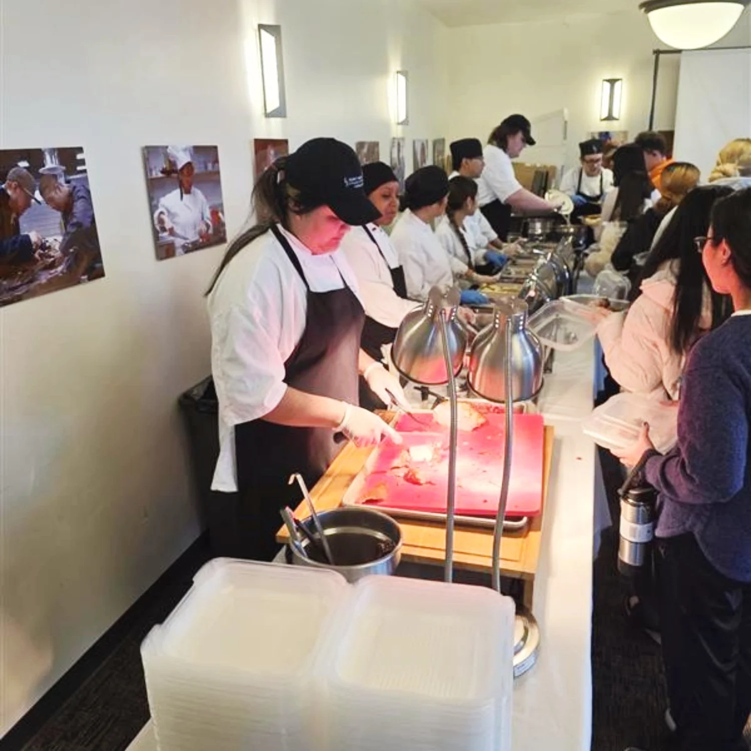 Culinary Arts students serving food they cooked to fellow students