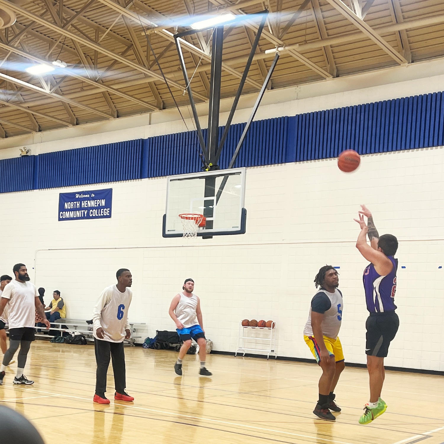 A group of student playing basketball as part of a Student Life activity.