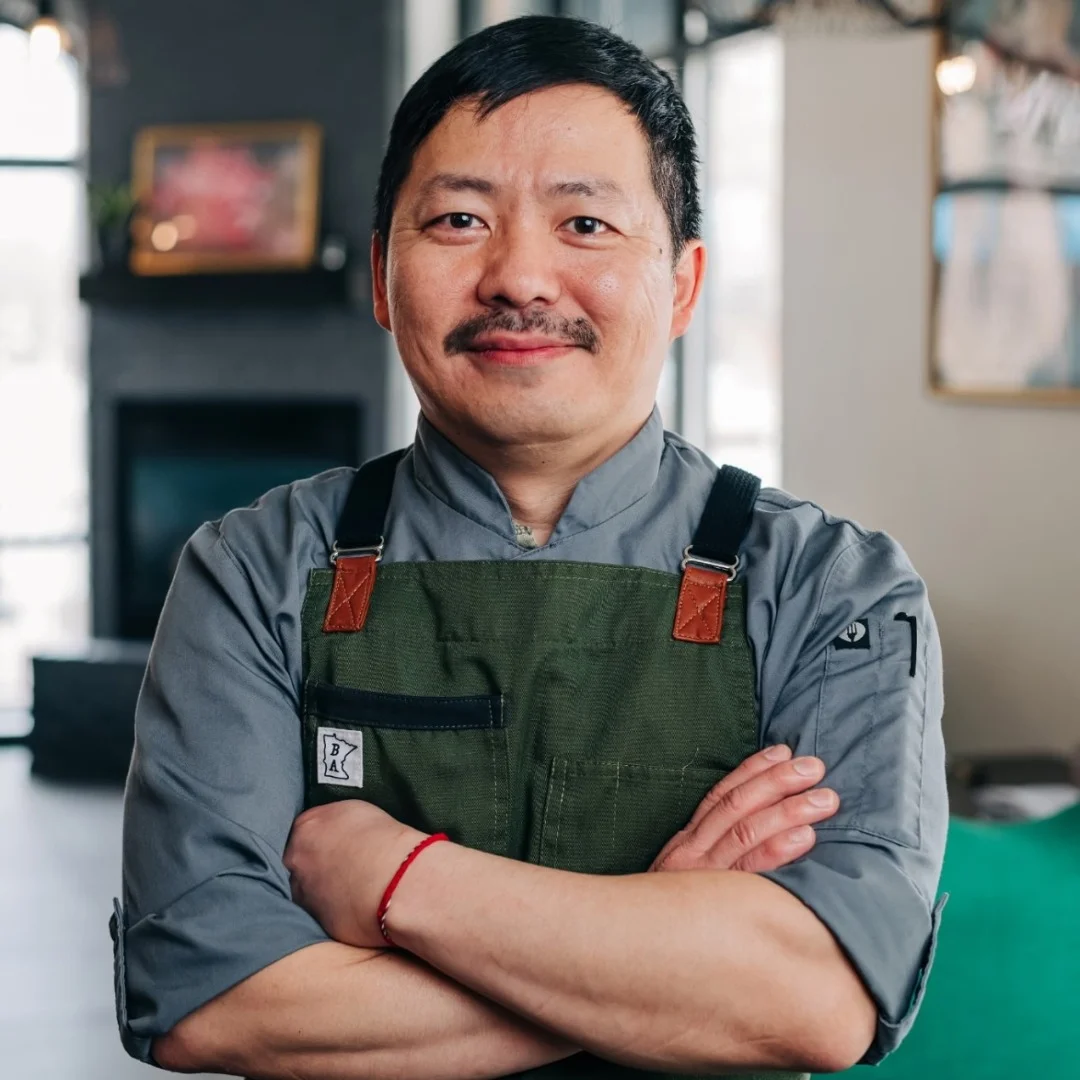 Kou Cha in the dining are of Pink Ivy Kitchen & Bar with his arms folded
